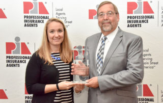 Danielle Wade and Wayne Sumner with PIA 2018 MGA of the Year Award