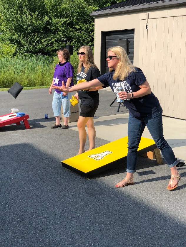 Tania Call, Haley Everett, Allison Gabriel playing in the JSA cornhole tournament 2018