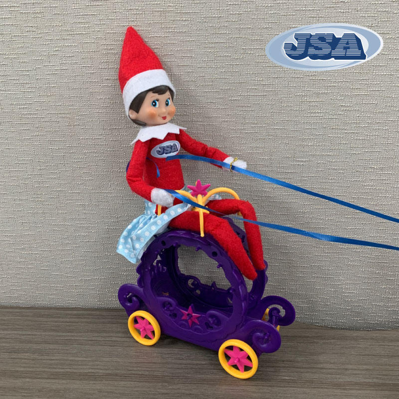 Brandy the elf taking a carriage ride
