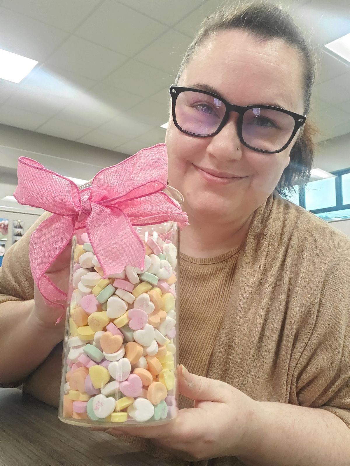 DeLaney holding a jar of hearts